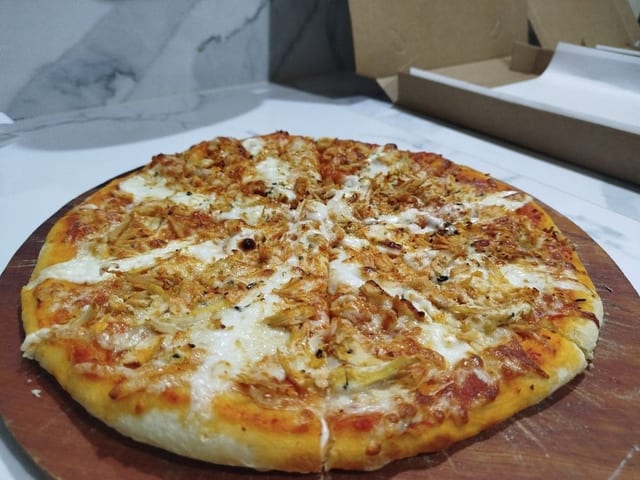 Pizza Pollo y katupiry de Café Roga